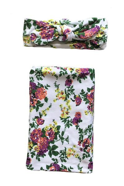 Floral jersey knit swaddle and matching headband. Stretchy jersey knit + cotton blend makes this the perfect swaddle for baby.
